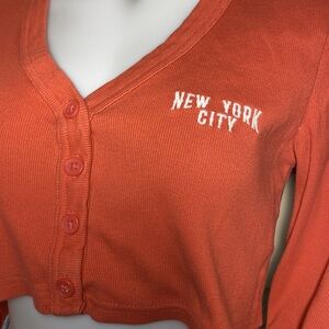 Forever 21 beautiful coral colored New York City thick ribbed half cardigan SM